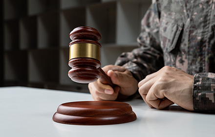 Military General Holding Judge Gavel To Deliver Court-Martial Charges