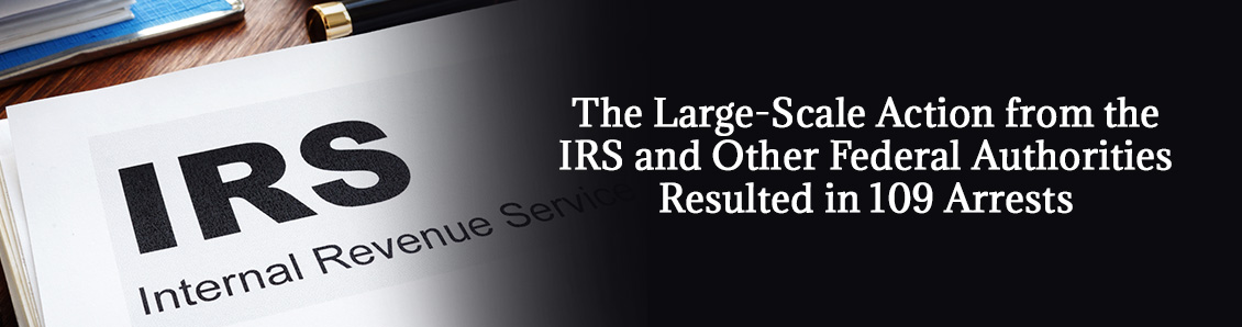 Magnifying Glass on IRS Logo To Represent the Identity Theft Crackdown