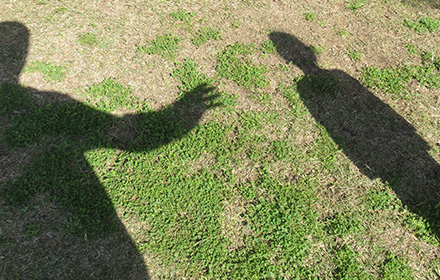 Shadow of Adult Man Preying on Young Boy To Represent the Offenses of Youth Baseball Coach