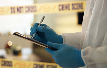 Crime Laboratory Analyst Collecting Evidence of a Crime Scene