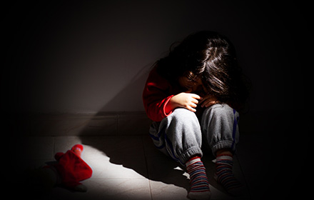 Child Curled Up on the Floor as Parents Face Charges of Child Neglect