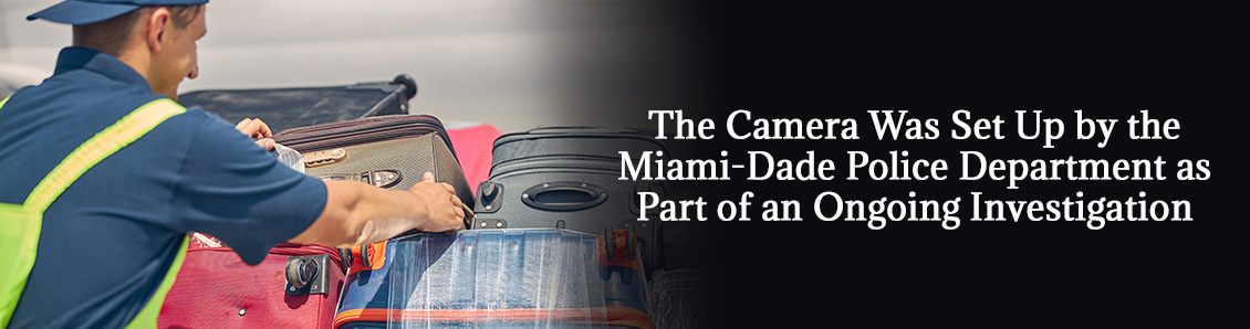 Baggage Handler Working with Passengers' Baggage at Miami International Airport