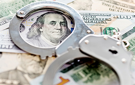 Handcuff Outlining the Print of Dollar Bill To Represent Money Laundering Offenses