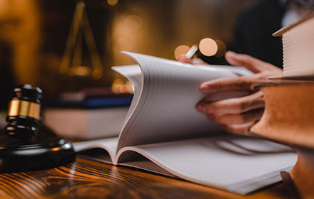Judge Gavel and Law Book in Preparation for a Criminal Trial